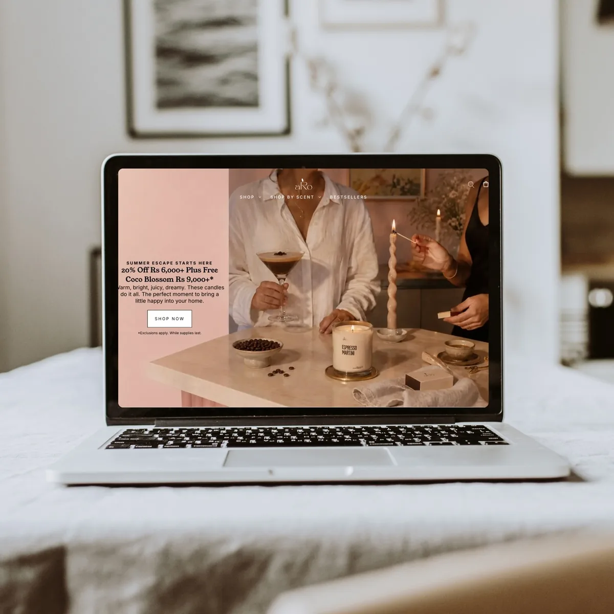 The aRo candle storefront on a laptop, showing a seasonal offer